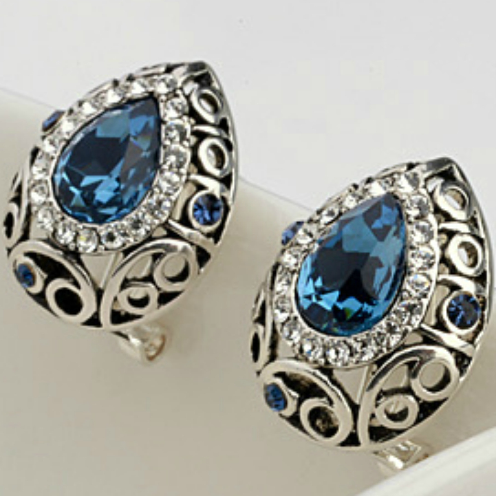 Sapphire blue omega back earrings with 18ct White Gold finish